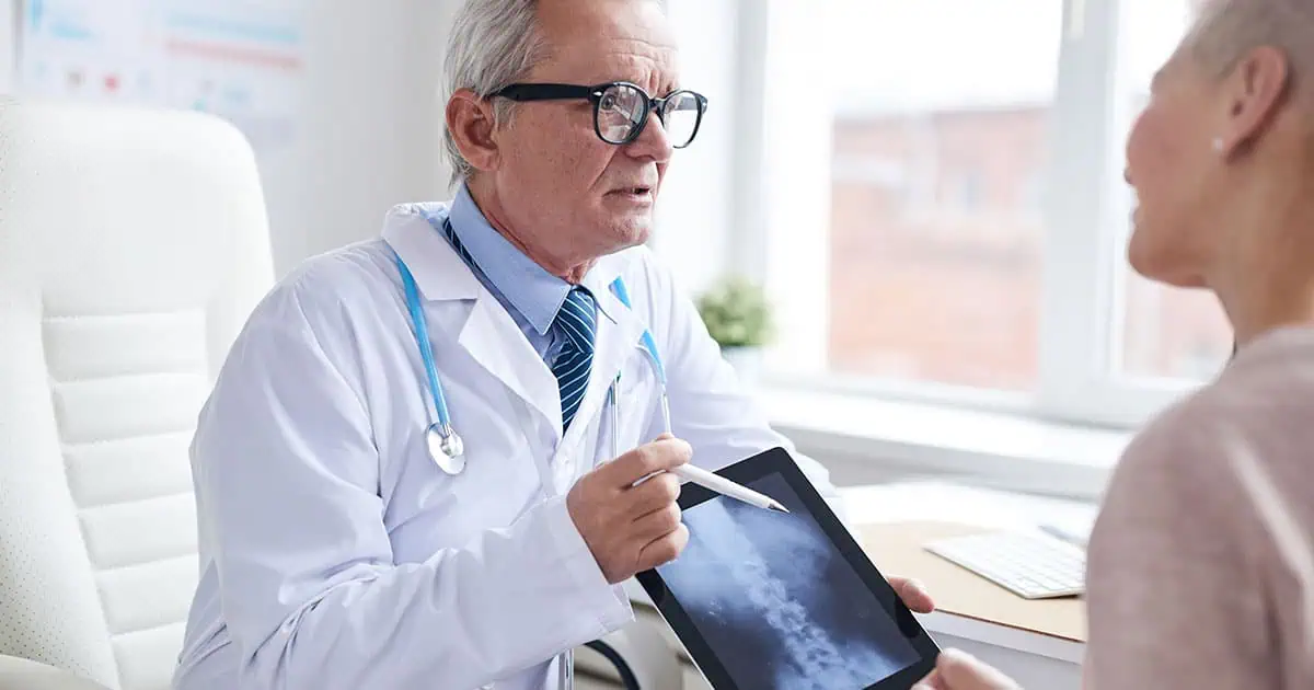 Spinal Cord Injury Doctor going over spinal cord injury with patient