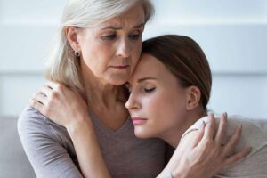 Mature Mother Comforting Adult Daughter