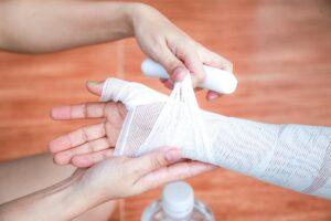 A burn injury victim getting bandages. What types of compensation are available for severe burn victims?