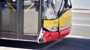 A damaged front-end of a bus after an accident. Who’s liable in a public transit bus accident?